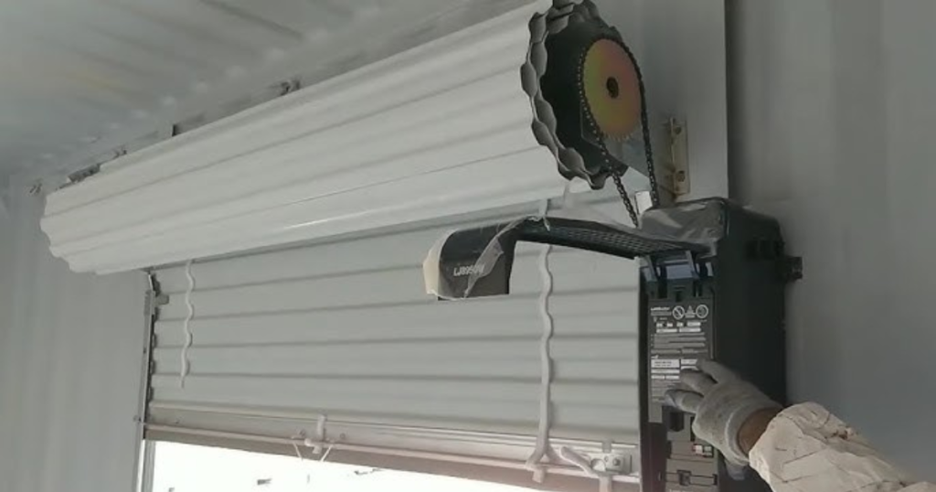 Gloved hand tests rolling shutter motor.