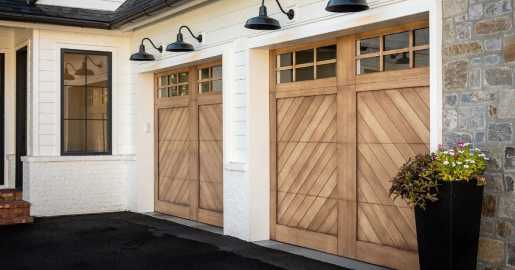 Two light wood garage doors with glass.