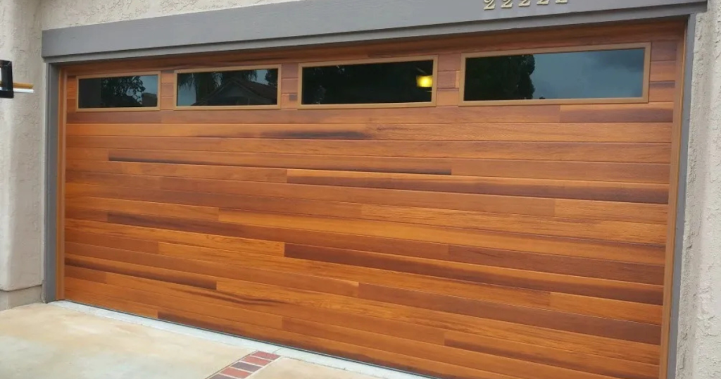 Modern wood garage door with windows.