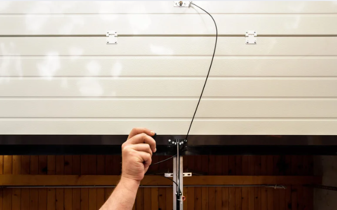 hand opening a garage door